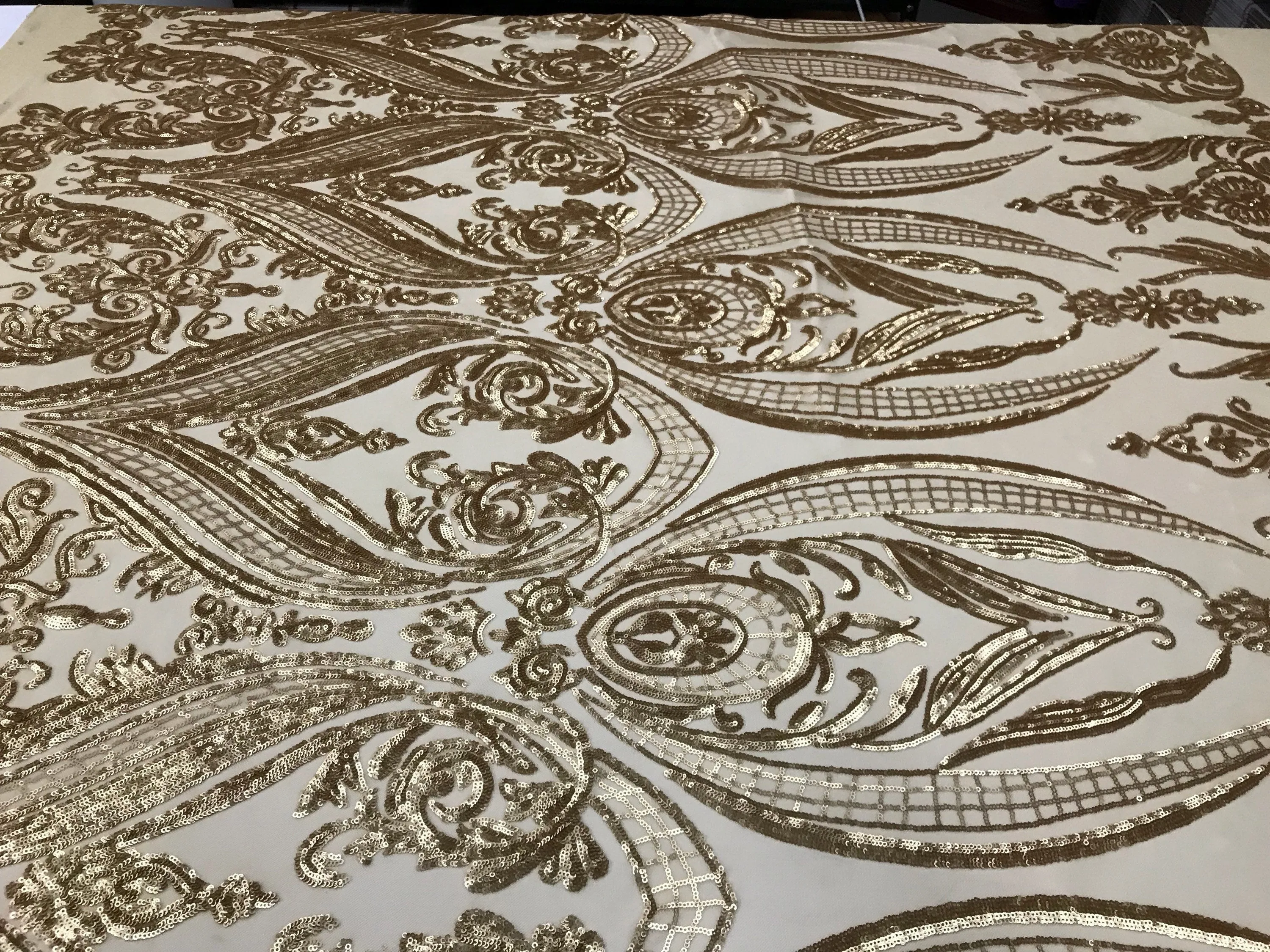 Matt gold princess design embroidery with sequins on a 4 way Stretch Mesh-dresses-sold by the yard