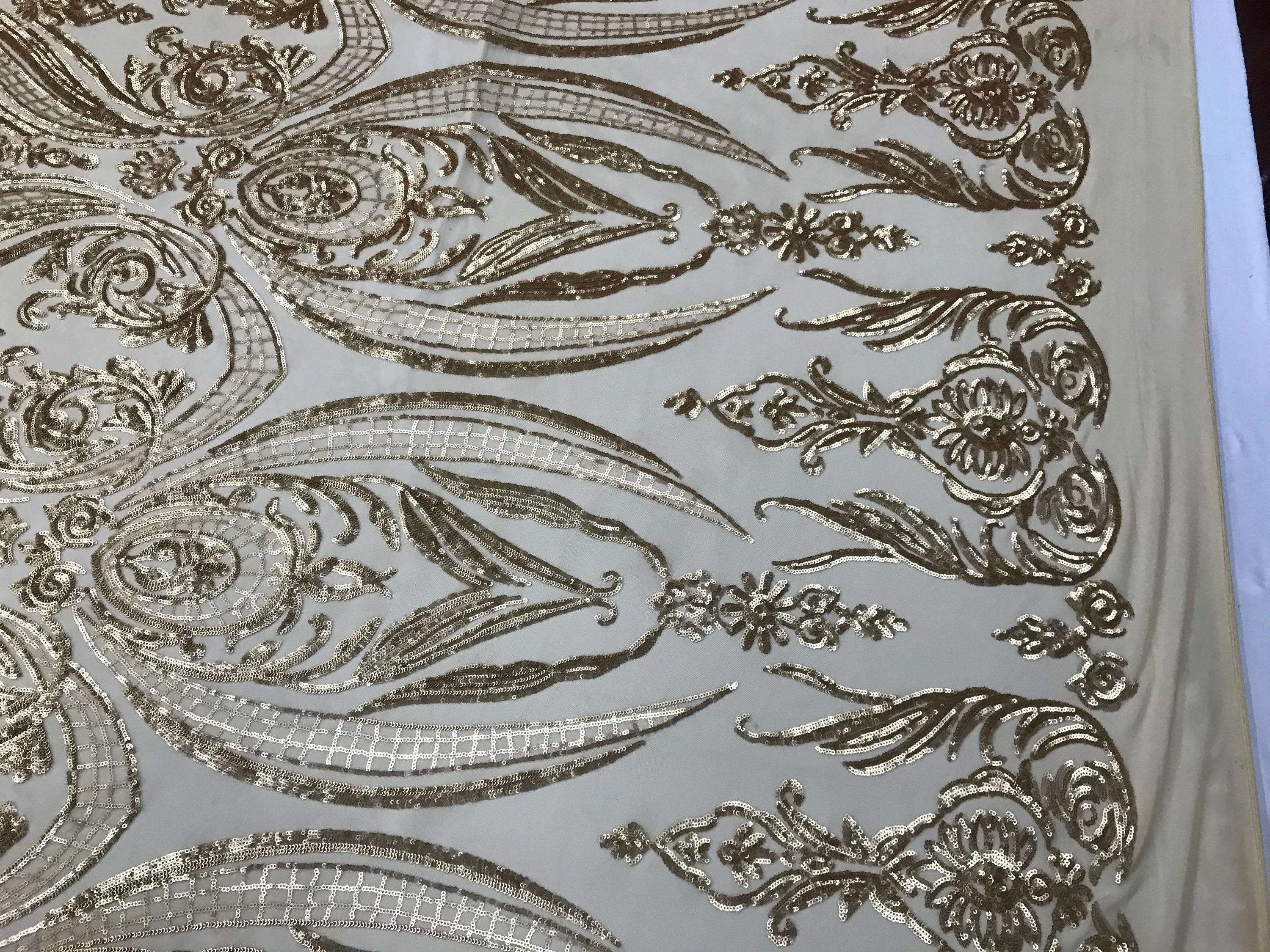 Matt gold princess design embroidery with sequins on a 4 way Stretch Mesh-dresses-sold by the yard