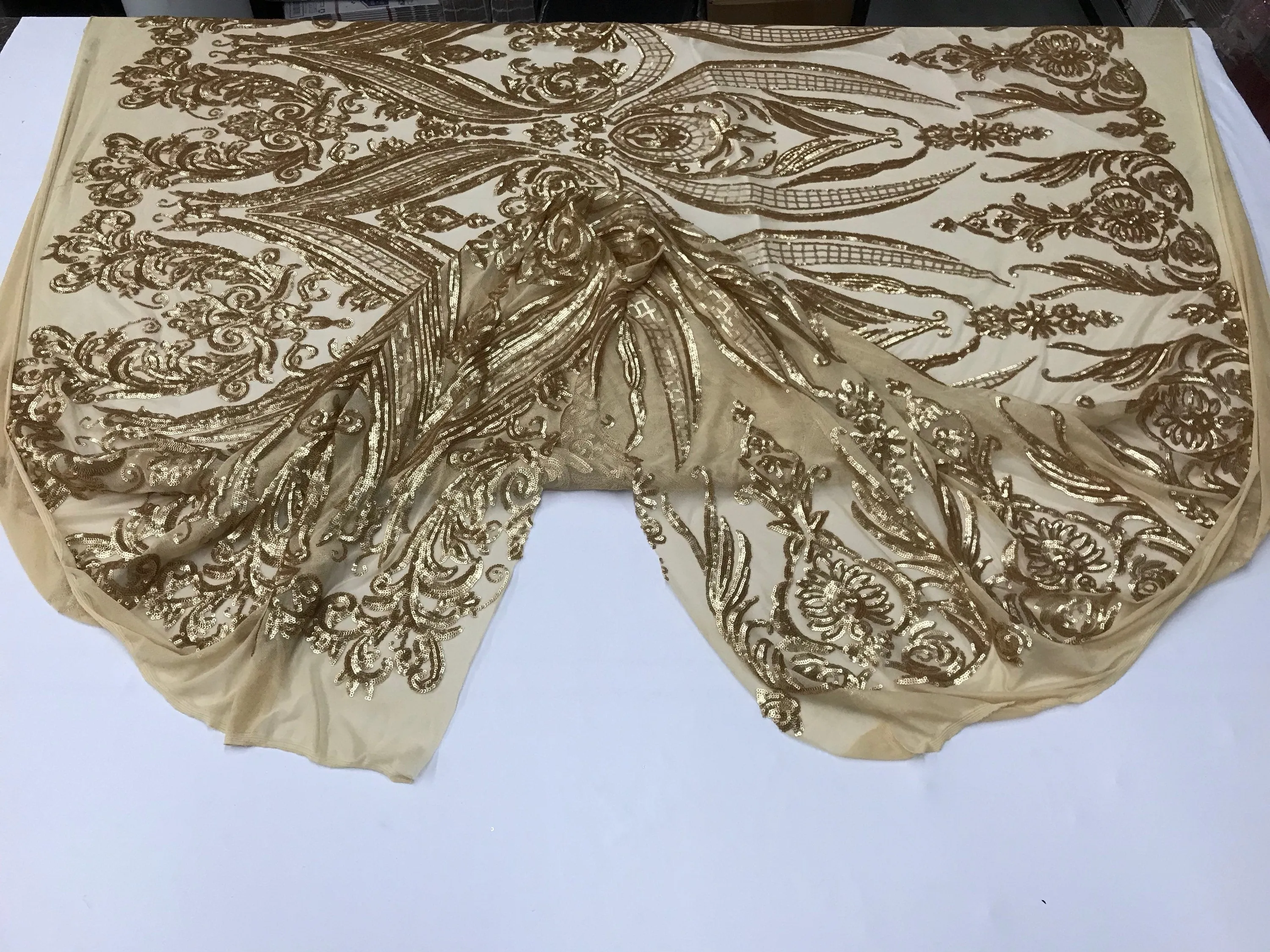 Matt gold princess design embroidery with sequins on a 4 way Stretch Mesh-dresses-sold by the yard