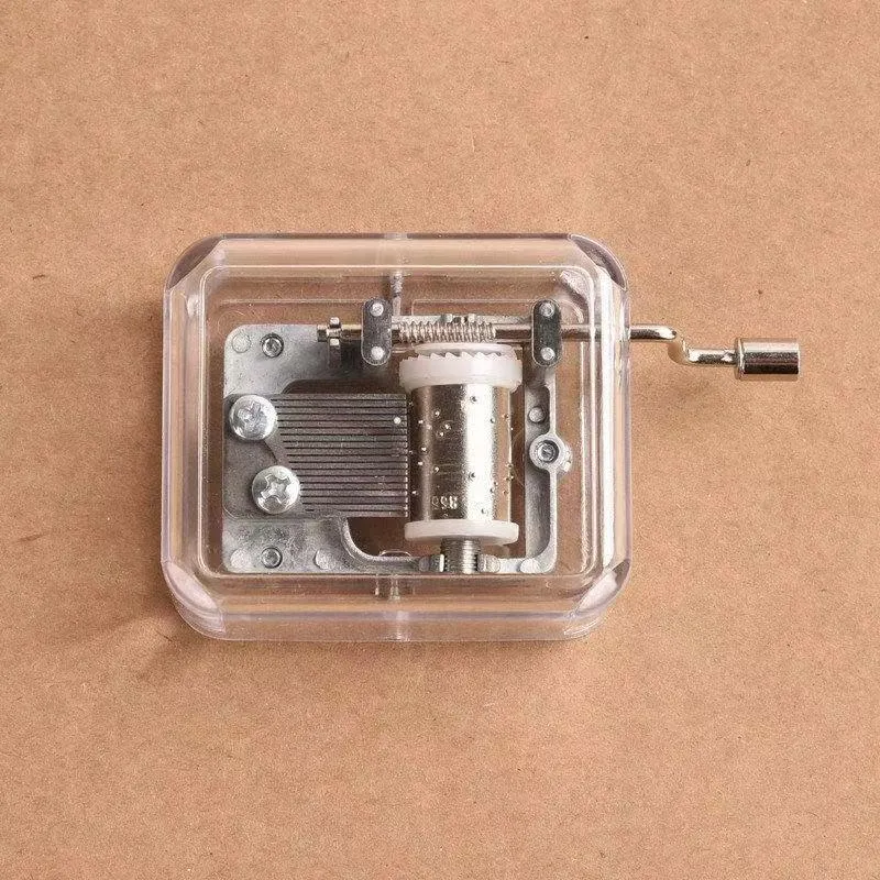 Simple transparent hand shaking music box