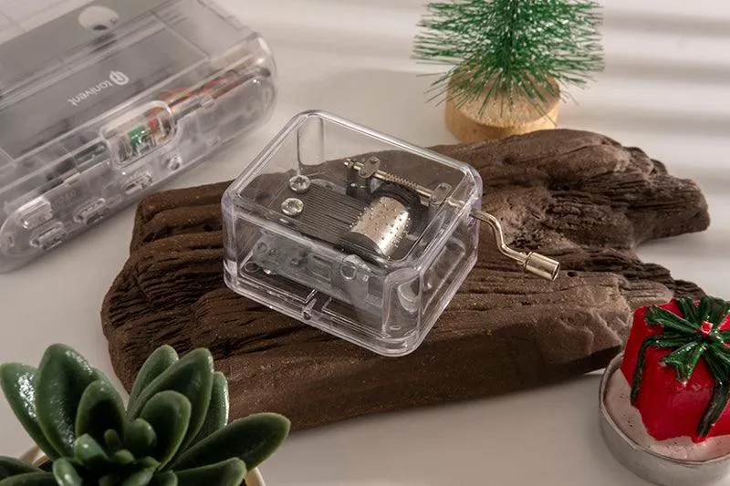 Simple transparent hand shaking music box