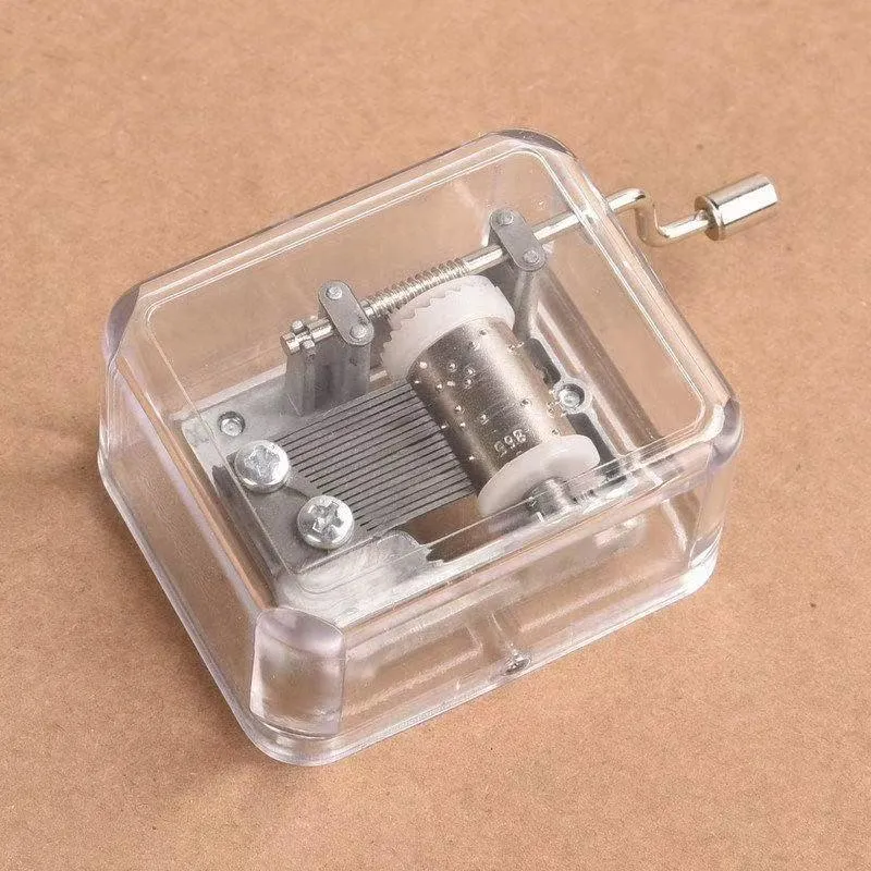 Simple transparent hand shaking music box