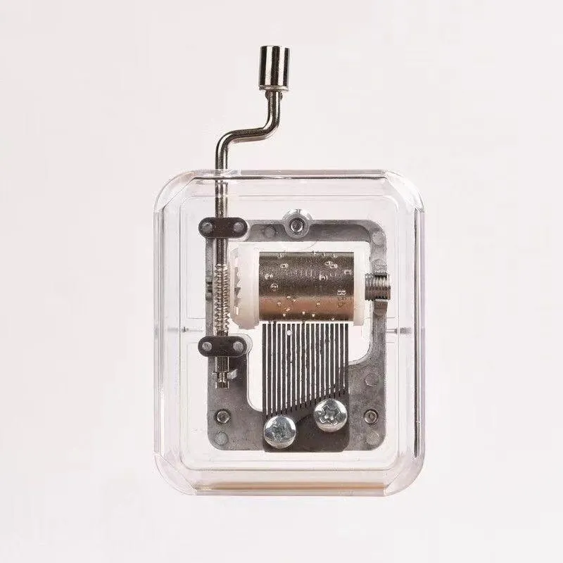 Simple transparent hand shaking music box